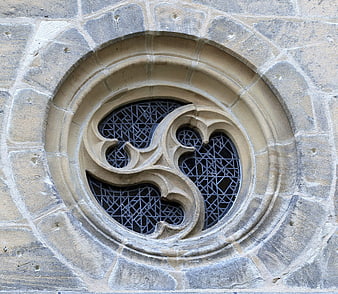 Gothic stone window detail with intricate tracery