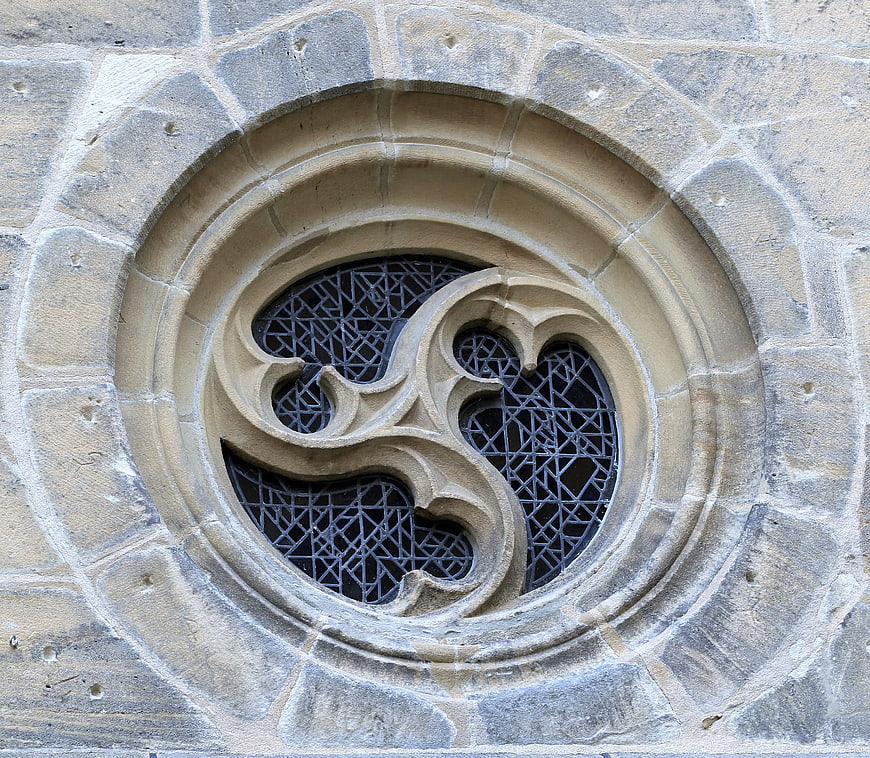 Gothic stone window detail with intricate tracery