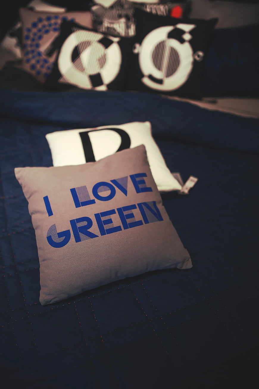 I Love Green Text Pillow on Blue Bedding