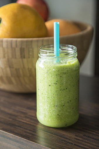 Green Smoothie in Mason Jar with Blue Straw