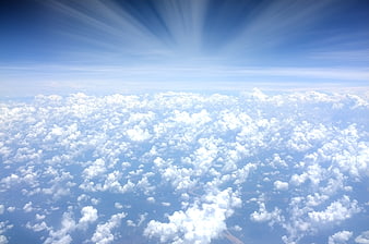Aerial View of Fluffy White Clouds and Blue Sky
