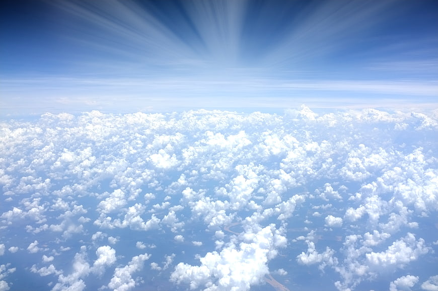 Aerial View of Fluffy White Clouds and Blue Sky
