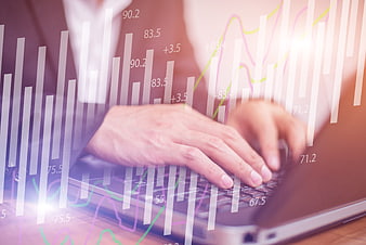 Businesswoman Typing on Laptop with Financial Graph Overlay