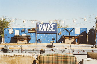 DIY Desert Stage with Blue Backdrop and Vintage Sofas