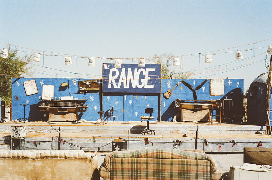DIY Desert Stage with Blue Backdrop and Vintage Sofas