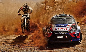 Rally car and motorcycle racing on dusty dirt track