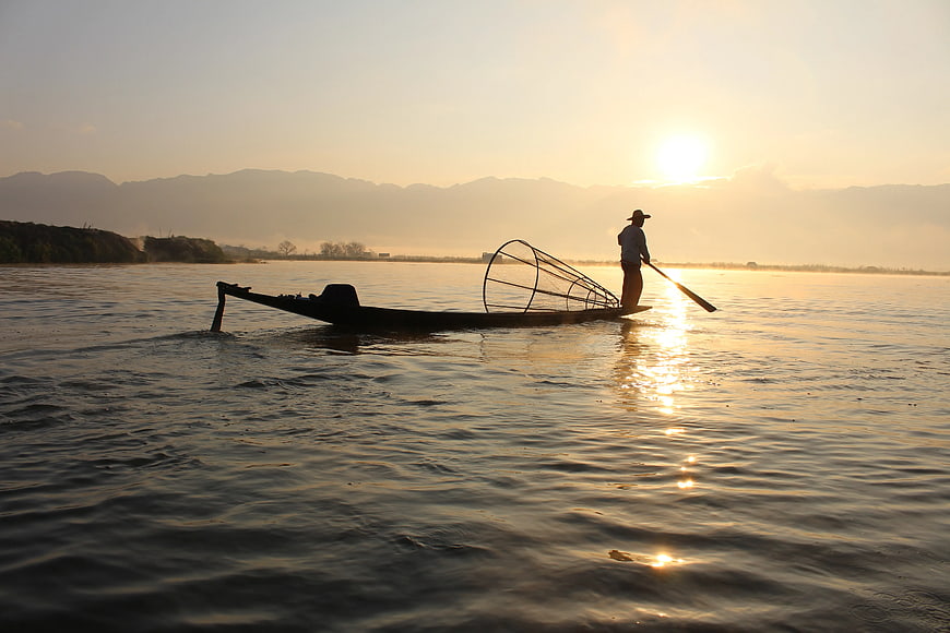 Silhouette of Inle Lake Fisherman Rowing at Sunset