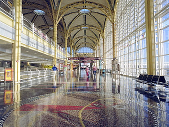 Spacious Airport Terminal Interior With Arched Ceiling And Mosaic Floor
