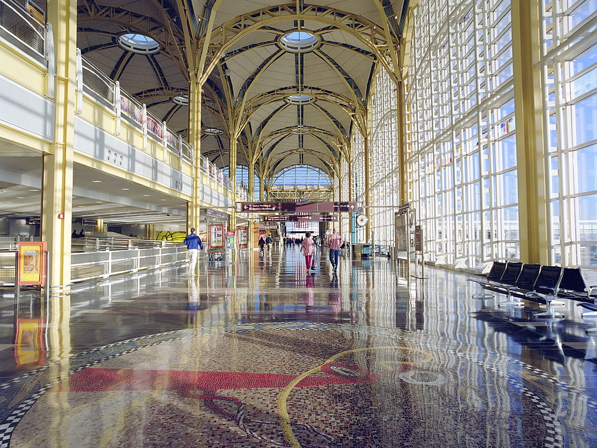 Spacious Airport Terminal Interior With Arched Ceiling And Mosaic Floor