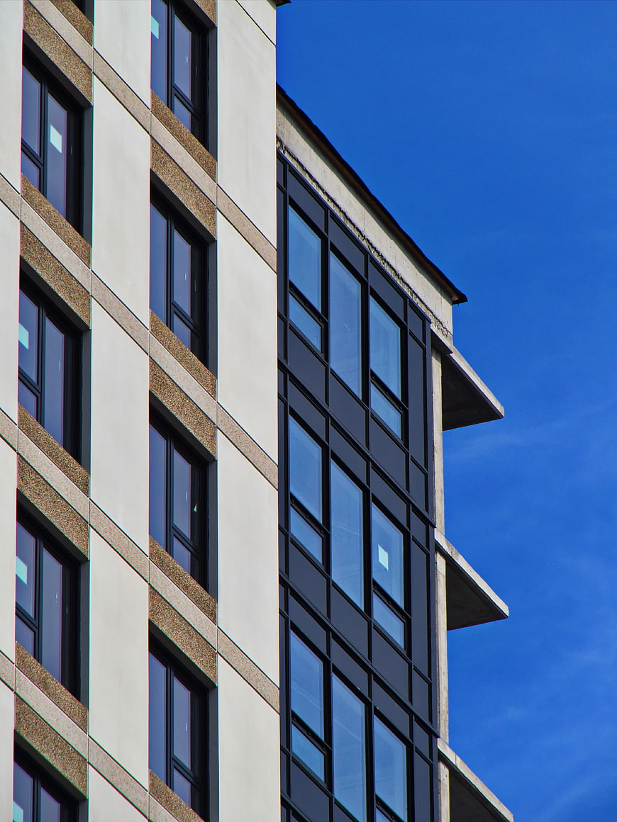 Modern Apartment Building Facade Against Blue Sky