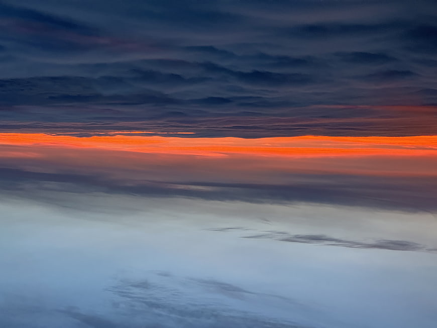 Dramatic sunset sky with vibrant orange and deep blue clouds