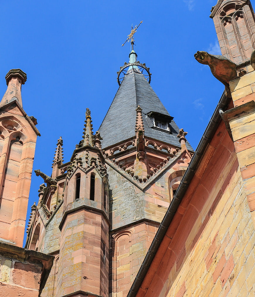 Gothic church tower spire against blue sky
