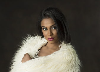 Glamour Portrait of Woman in White Fur Wrap