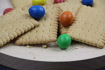 Close-up of square crackers with colorful candy balls