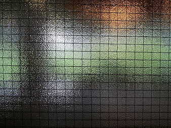 Abstract Textured Glass Surface With Grid Pattern And Colorful Light