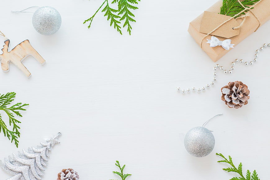 Minimalist Christmas Flat Lay with Silver Ornaments and Gift