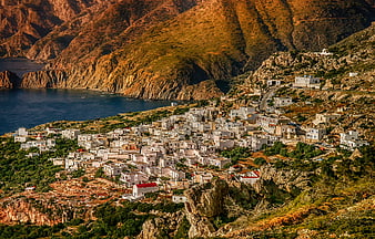 Aerial View of White Village on Greek Island Coastline