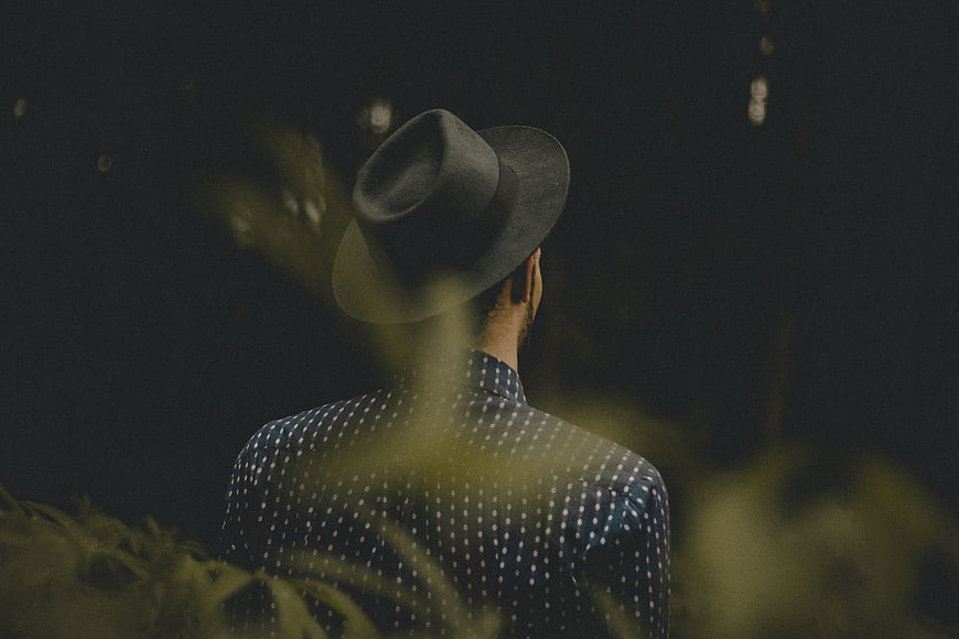 Man in Fedora and Polka Dot Shirt from Behind