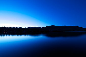 Serene Blue Hour Lake with Mountain Silhouette