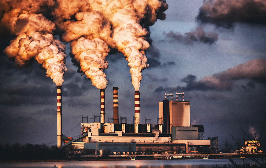 Industrial Power Plant Smokestacks Emitting Steam at Dusk