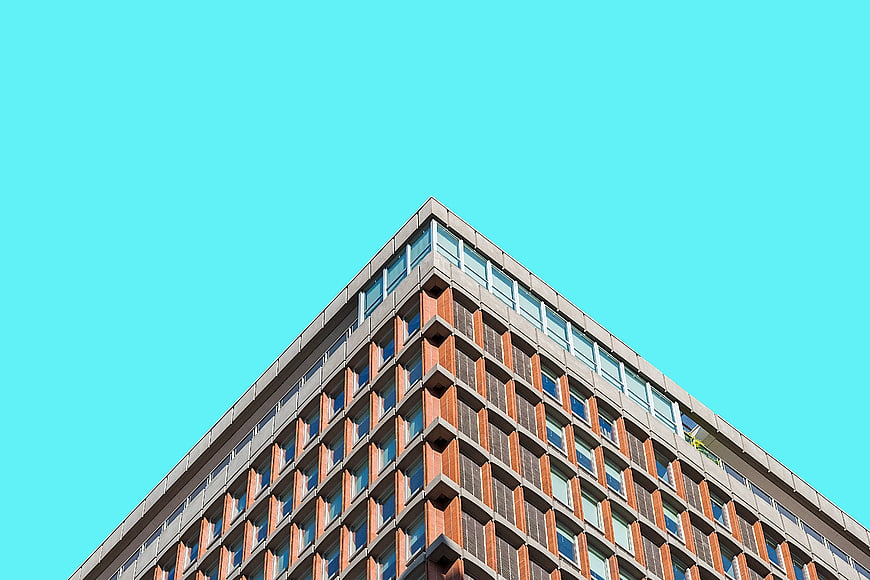Modern Brick Building Corner Against Blue Sky