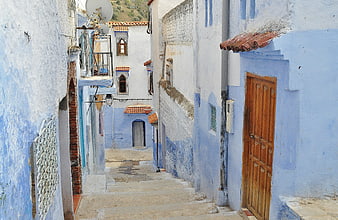 Narrow Blue Alleyway In Moroccan Town With Stone Steps