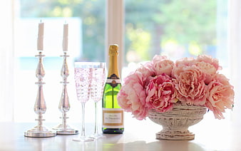 Pink Peonies, Champagne, and Silver Candlesticks on a Table