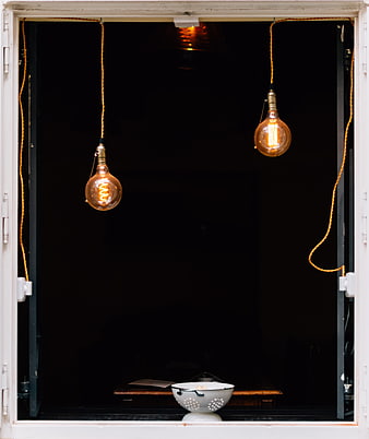 Vintage Edison Bulbs Hanging in Dark Window Frame