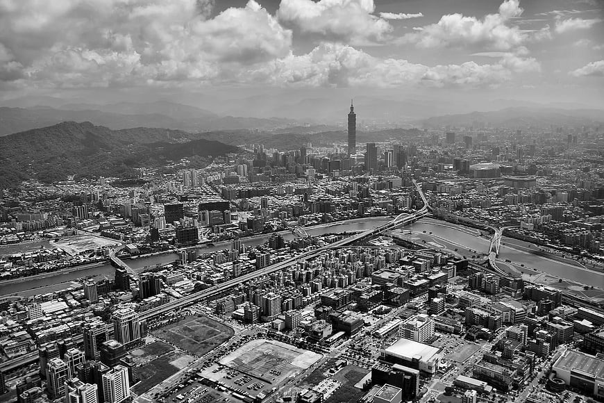 Black and white aerial view of Taipei cityscape with Taipei 101