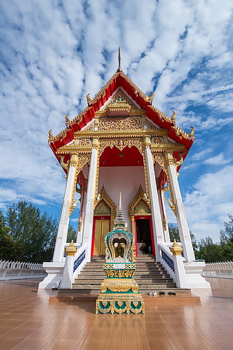 Traditional Thai Temple Architecture with Blue Sky