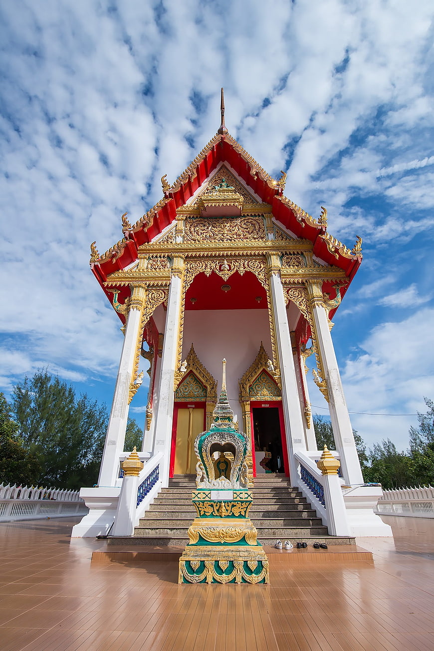 Traditional Thai Temple Architecture with Blue Sky