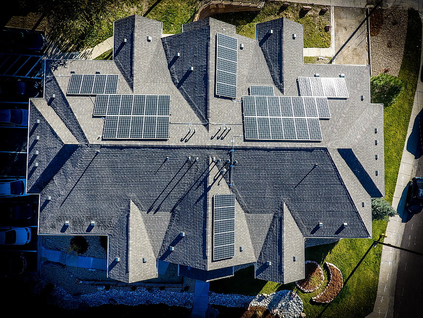 Aerial view of residential roof with solar panels
