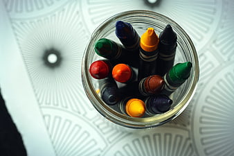 Top View of Colorful Crayons in Glass Jar