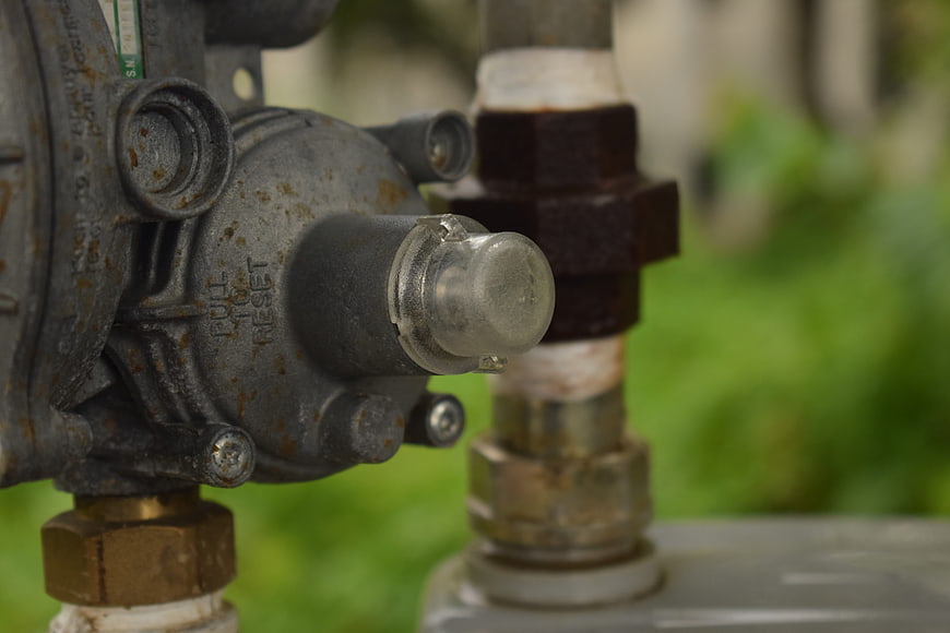 Close-up of rusty industrial gas valve mechanism