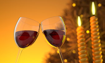 Two glasses of red wine toasting with candles in background