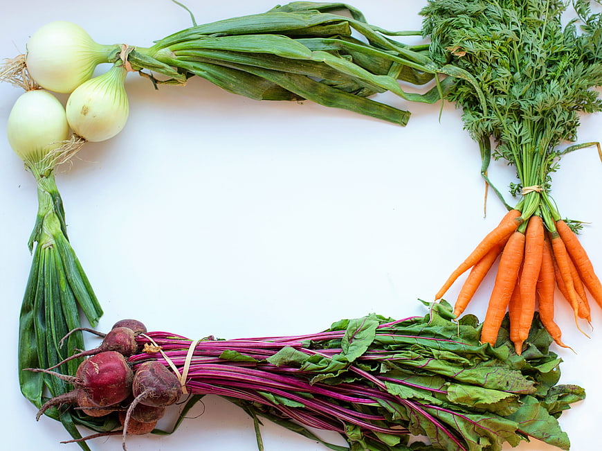 Fresh vegetables border frame on white background