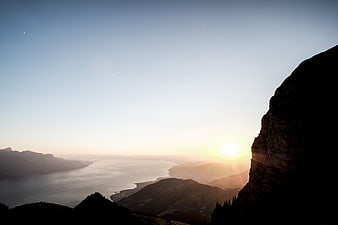 Sunrise Over Mountain Lake With Silhouette Cliff
