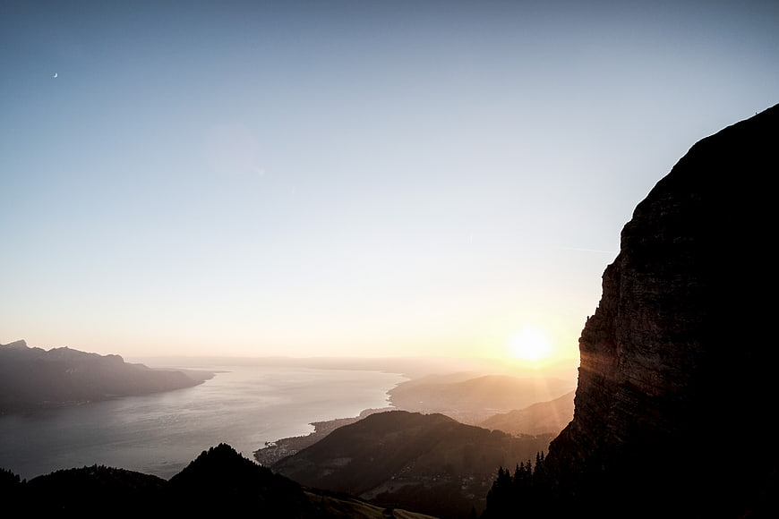Sunrise Over Mountain Lake With Silhouette Cliff