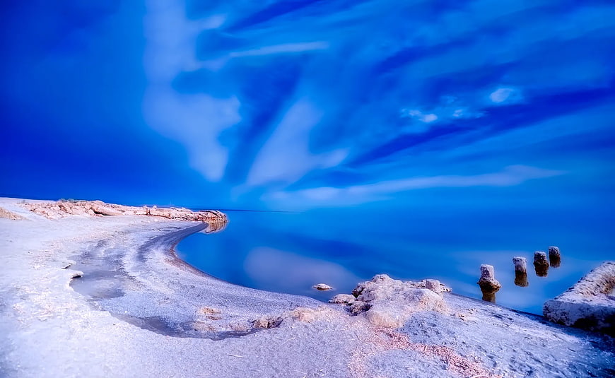 Surreal Blue Salt Lake Shoreline with Streaked Sky