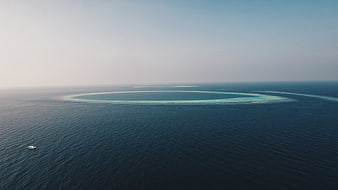 Aerial View of Tropical Atoll and Deep Blue Ocean