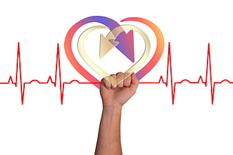 Hand holding heart shape with medical pulse line