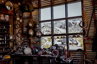 Vintage Auto Parts Shop Interior with Snowy Mountain View