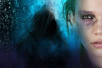 Woman with bruised eye and hooded ghost figure in blue