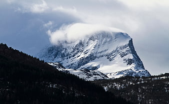 Majestic Snow-Capped Mountain Peak with Clouds
