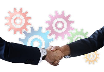 Business handshake with colorful gears symbolizing collaboration and teamwork