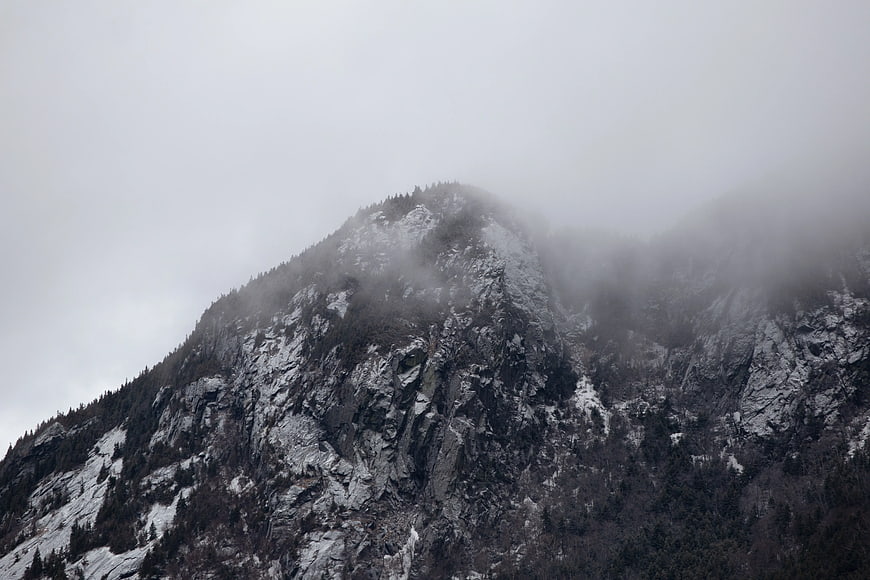 Misty Mountain Peak with Snow and Fog