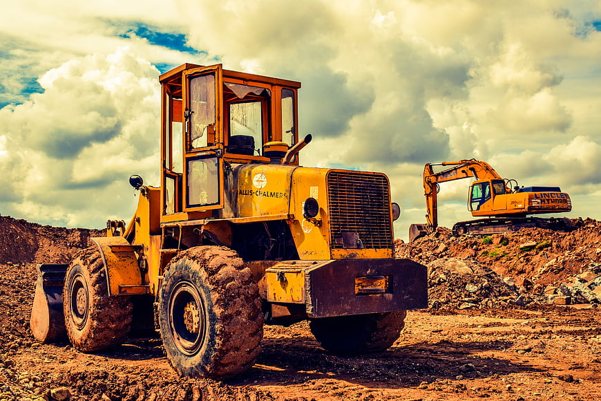 Vintage yellow Allis-Chalmers loader on construction site