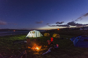 Camping at Night with Bonfire and Starry Sky