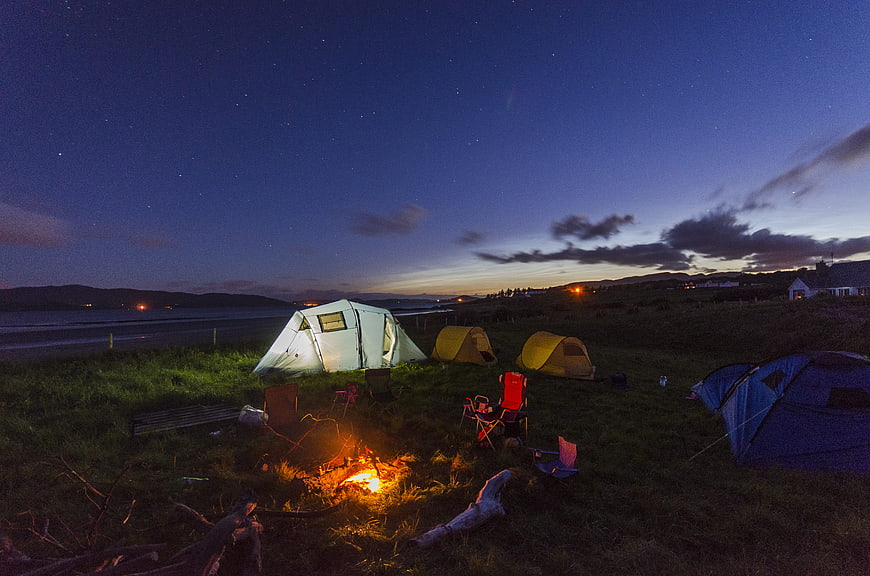 Camping at Night with Bonfire and Starry Sky