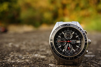 Silver Casio Chronograph Watch on Concrete Surface